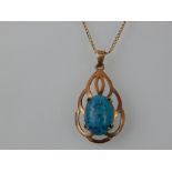 A Victorian style 9ct yellow gold and turquoise pendant, on 9ct gold chain.