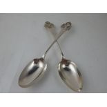 A pair of Edwardian silver table spoons, Sheffield 1906, the terminals with crest of rearing horse