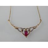 A 9ct yellow gold and ruby set necklace.