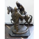 A cast bronze figure of an Arab horsewoman with a gentleman beside her, H. 43cm.