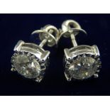 A pair of 18 carat white gold and solitaire diamond ear studs, the stones of 2.0 carats combined.