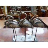 A silvered metal sculpture of six storks. H.