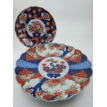 A late 19th century imari porcelain dish, decorated with a central vase of flowers, together with