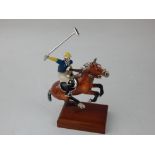 A limited edition Saturno silver and enamel polo player ornament, mounted on rectangular mahogany