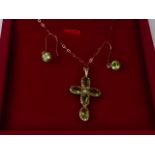 A peridot and split seed pearl cross pendant, in 9ct mount, with a pair of similar earrings.