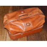 A tan leather grip bag, with brassed fittings, W. 58cm.