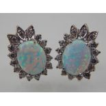 A pair of Victorian style opalite and cubic zirconia earrings.