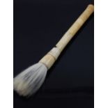 An early 20th century Anglo Indian ivory fly whisk, with sectional shaft.