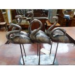 A silvered metal sculpture of six storks. H. 43cm