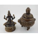 An bronze incense burner, the top with Buddha head finial, the body embossed with dragons chasing