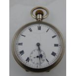 A white metal open faced pocket watch, the enamel dial with Roman numerals, subsidiary seconds