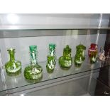 Ten pieces of Mary Gregory style Bohemian green glassware, typically enamelled with children amongst