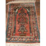 A Indian part silk prayer rug, decorated with floral mirab medallion to centre, fringed, 90cm