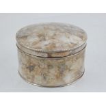 A circular silver plated box, the cover with beaded rim. D. 15cm