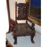 A 17th century style child's chair, with cane upholstered back and seat with open arms, above