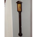 A mid 20th century George III design mahogany stick barometer, with broken arch pediment over an