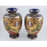 A pair of late 19th / early 20th century Satsuma Seizan vases, decorated in the Meiji period style