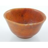 A 19th century Chinese soapstone sake cup. H. 3cm