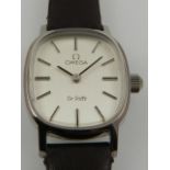 A ladies Omega De Ville wristwatch, the silvered dial with baton markers on associated leather