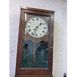 An ealry 20th century oak cased wall clock, the white painted dial set out in Roman numerals, H.
