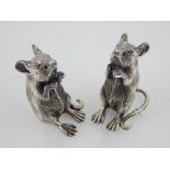 A pair of silver novelty condiments, modelled as seated mice stamped Sterling to base.