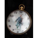 A brass and glass ball clock, the dial decorated with Lenin.