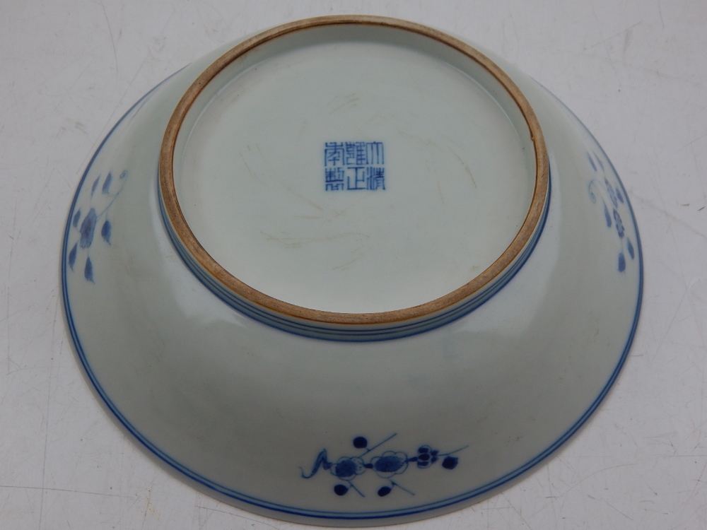 A Chinese Yongzheng style blue and white dish, decorated with women in a pagoda, bears seal mark - Image 2 of 2