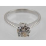 An 18 carat white gold solitaire diamond ring.