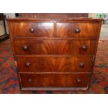 A late George III mahogany chest of drawers, the crossbanded rectangular top above two short over