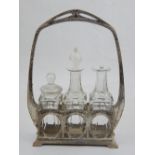 An early 20th century three bottle cruet stand, in the Art Deco manner, H. 24cm