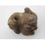 A 19th century Chinese soapstone Dog of Fo, with two applied puppies.