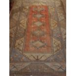 A cream ground Turkish Milas rug, decorated with geometric design, fringed. 300x 165cm