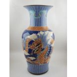 A Chinese baluster shaped vase, decorated with dragon and phoenix on a blue ground, H. 52cm