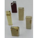 Five various cigarette lighters.