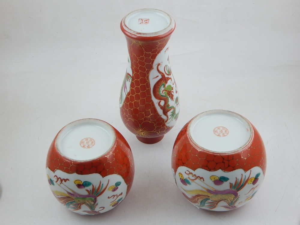 A pair of Chinese porcelain ginger jars and covers, decorated with vignettes of phoenixes and - Image 2 of 2