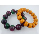 An amber coloured beaded bracelet, together with an beaded hardstone bracelet. (2)