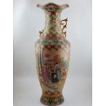 A Satsuma style baluster shaped vase, with rippled rim and twin handles, decorated with vignettes of