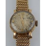 A ladies 9ct gold Omega manual wind wristwatch, the round dial with Arabic numerals and baton
