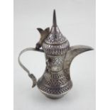 A mid 20th century silver Omani dallah coffee pot. H. 17cm