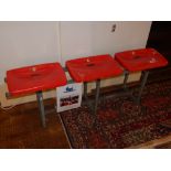 A triple seat row from the old Wembley stadium, the red plastic seats numbered 123-125 and