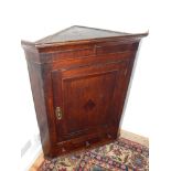 A Georgian corner cupboard, fitted interior above drawer, H.