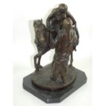 A bronze figure of an Arab horsewoman, with a gentleman standing beside her, H.