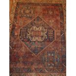 A Qashqai carpet, decorated with stylised floral design, 143x116cm.