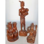 Three Indonesian hardwood carvings, the largest of a farmer with a chicken, H. 73cm, (3).