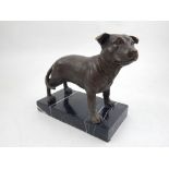 A bronze model of a Staffordshire Bull Terrier, on a marble base, H. 14cm.