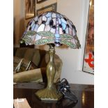 A Tiffany style table lamp, the shade decorated with dragonfly, H. 40cm.