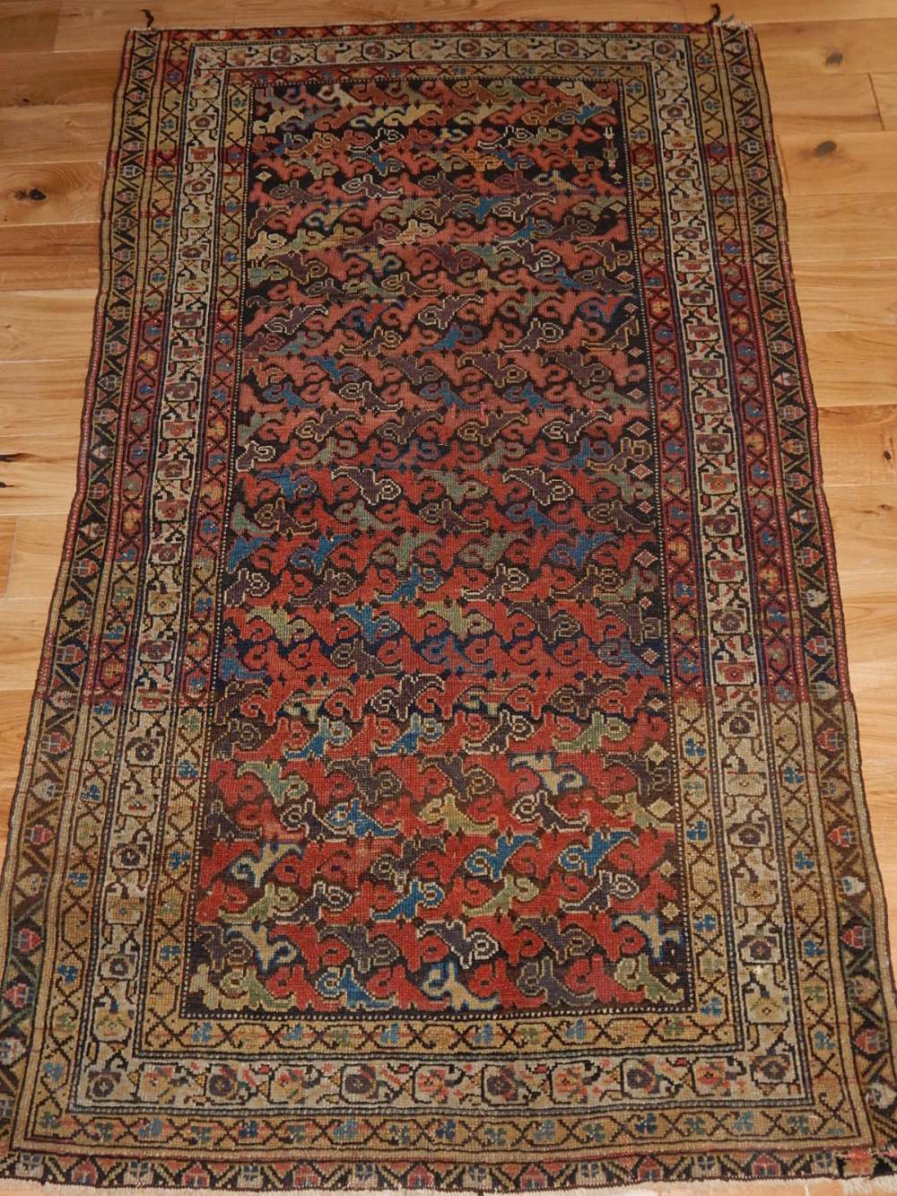 South West Russian rug, decorated with geometric pattern, within similar decorated borders,L.