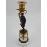 An Empire style candlestick, the bronze female figure supporting a gilt sconce,