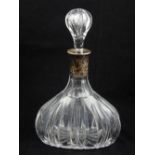 A German cut glass decanter, fitted with a white metal collar bearing purity marks and stamped 800.