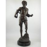 A bronze figure in the manner of Machelagelo, David, his arms bound by a hawser, on a marble plinth,